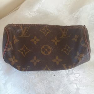 Louis Vuitton, small carrying case.